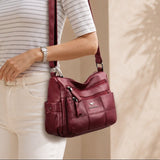Burgundy leather crossbody bag with braided front, adjustable shoulder strap