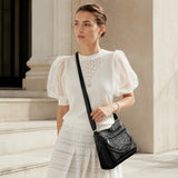 Black leather crossbody bag with braided front and adjustable shoulder strap