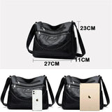 Black leather crossbody bag with front zipper pocket and braided trim, adjustable strap