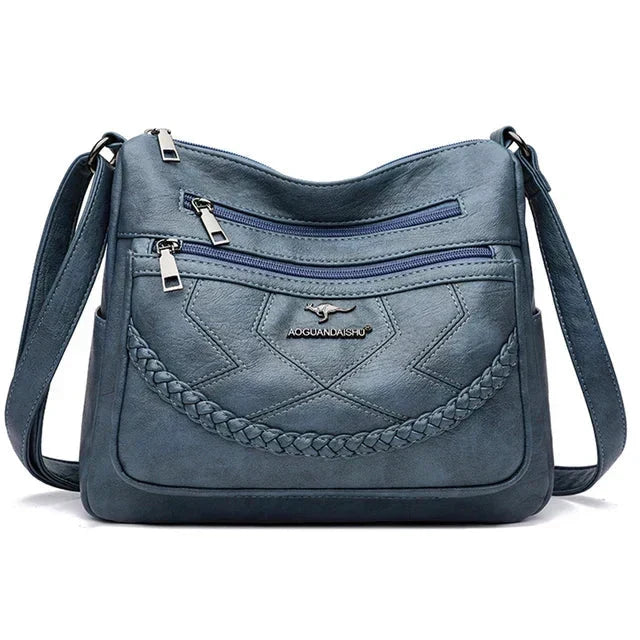 Light blue leather crossbody bag with braided panel and zip pockets, AOGUANDANSHUO